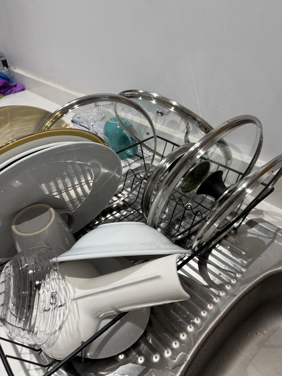 Kitchen and dish care with clean plates and cookware